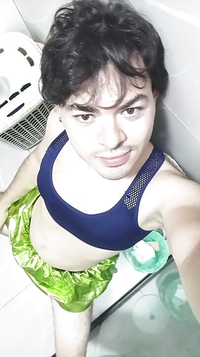 gay femboy sexy skirt lingerie and licking lollipop