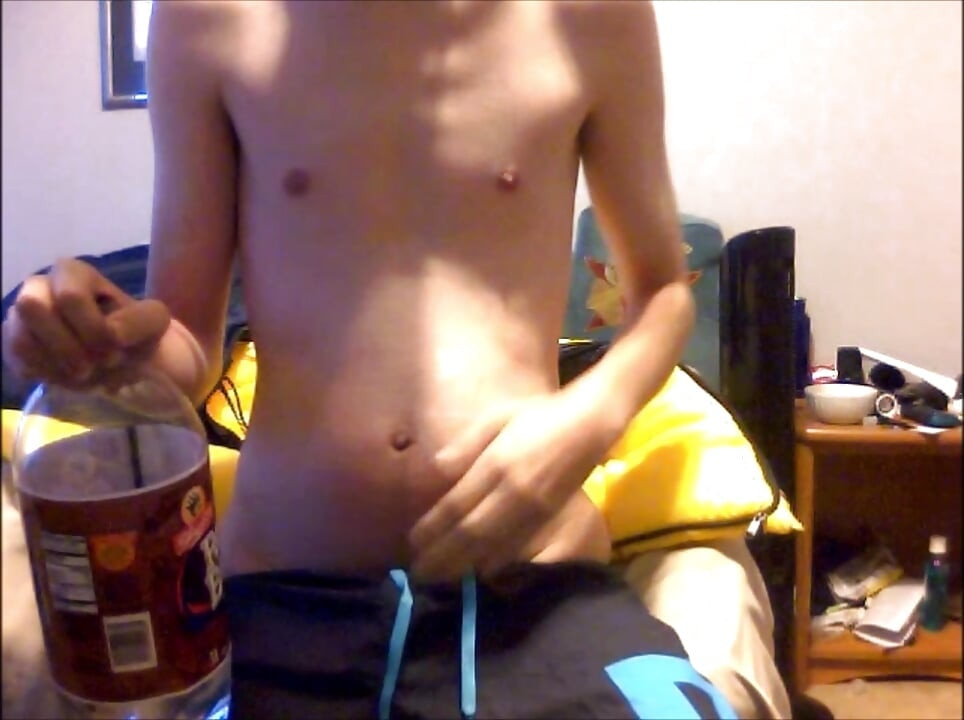 Young Guy Fills His Stomach with Water