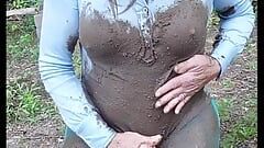 Sexy Crossdresser outside in a muddy mess. I masturbate my big cock and cum in mud, nylon pantyhose and leotard.