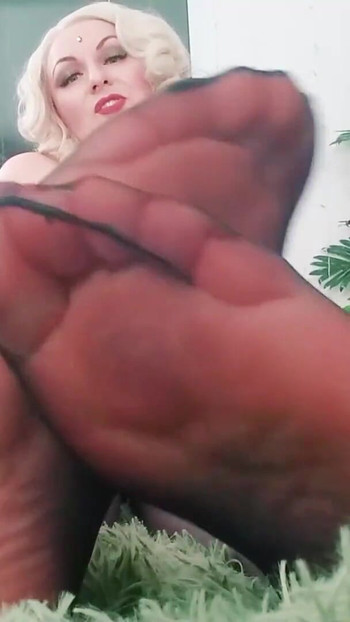 Emotional moment from "Foot Fetish Video: sexy black NYLON feet. Dominant hot blonde MILF Arya Grander"