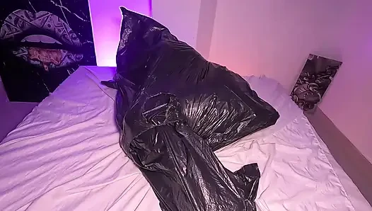 Girl in Garbage Bag Plays with Her Breath