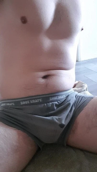 Uncut guy peeing in underwear and on self