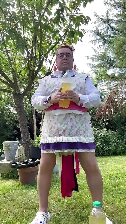 In gardener's clothes to take a piss shower outside fully dressed