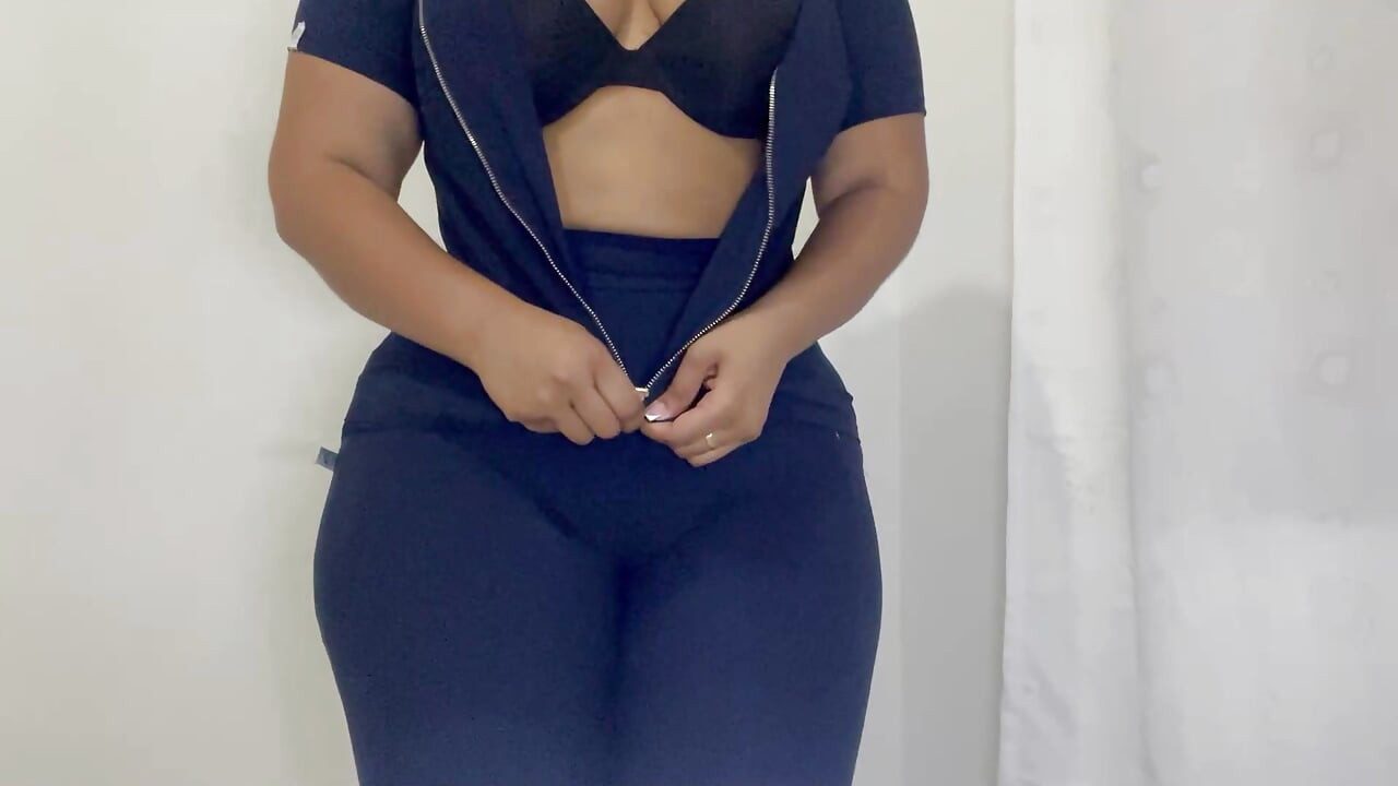 VOLUPTUOUS NURSE SHOWING HER TRANSPARENCIES IN FRONT OF THE CAMERA