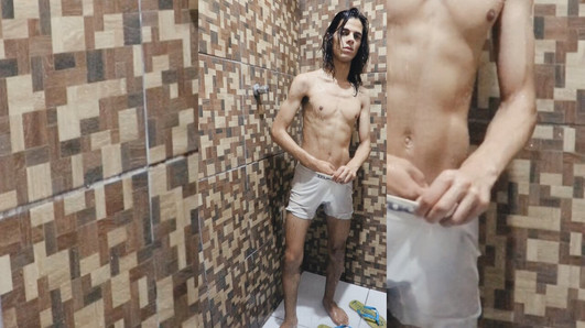 Skinny teen is taking shower in white boxers