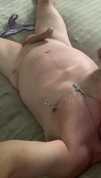 Laying in bed with nipple clamps on, tugging my nipple clamps and stroking my cock with my sissy panties on the bed
