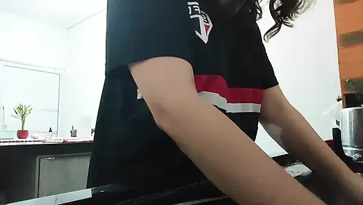 Woman teasing while washing dishes. She loves to transmit to the voyeurs on duty