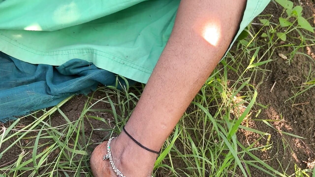 The sister-in-law of the village shows her figure in the open field, a tight-bodied, Indian-looking woman.
