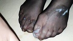 Black nylon sock on Wife's french toenails in detail covered by big cum load