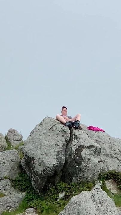Zoey masturbating in public high up on a rock in the harbor