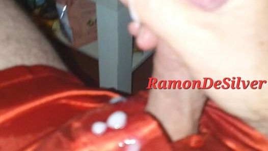 Master Ramon massages, spits and jerks off his divine cock and watches SM video in hot red satin shorts, hot
