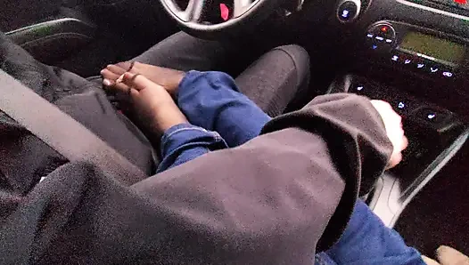 Amateur MILF in jeans and nylon socks gives a taxi driver a footjob