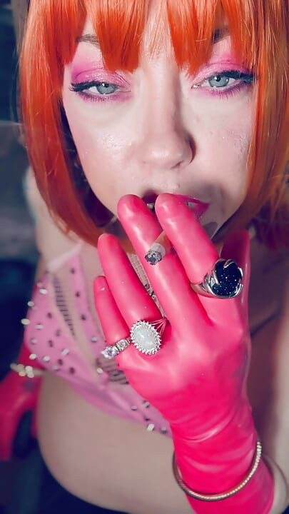 Sweet In Pink! Tina Snua Dressed In Pink Latex Gloves Smoking A Cork Cigarette - Snap Inhales Drifting Smoke OMI OME Dangles