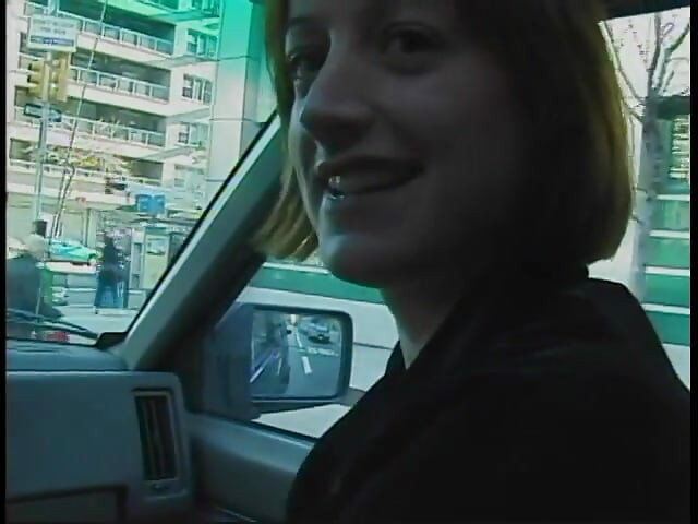 Commuter redhead carpools with creep who debases her in car in city traffic