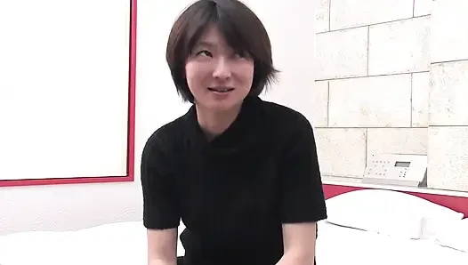 Sweet Japanese MILF takes on two hard cocks