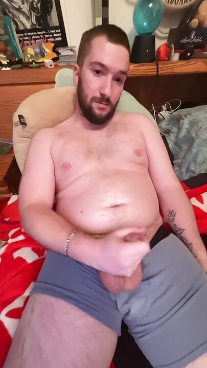 Chubby boy jerks off in bed