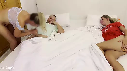 Girlfriend sneaks into swinger couple bedroom to fuck husband