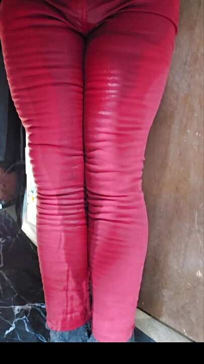 Satisfying soaking of red skinny jeans