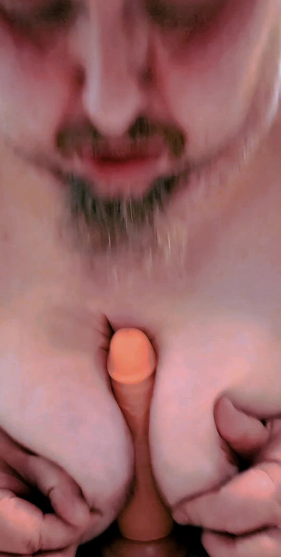 Sucking and titty fucking my dildo.