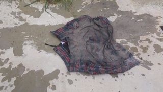 crush wet ash on red tartan skirt