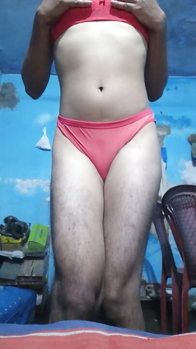 Young sissy crossdresser in her step sister's red bra and thong panties