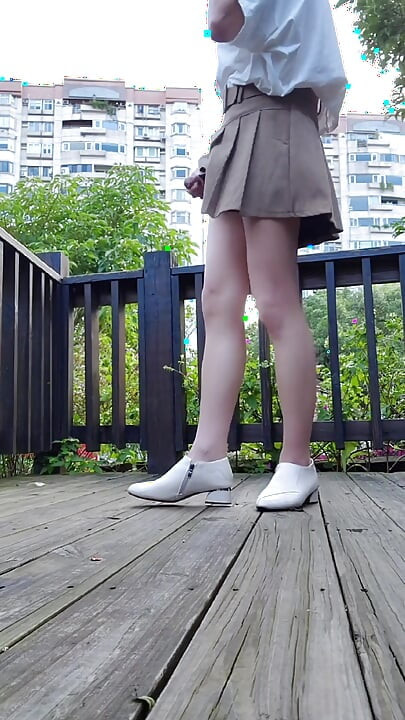 Shemale Ting Xuan Masturbates Outdoor and Ejaculates on Her Legs.