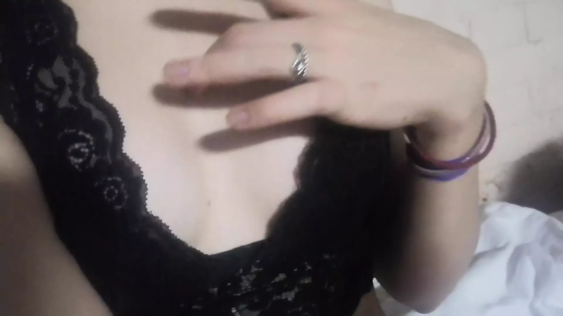 Gentle striptease in black lace lingerie. Close-up