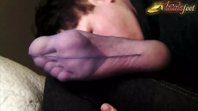 Trans is licking foot in pantyhose and masturbates