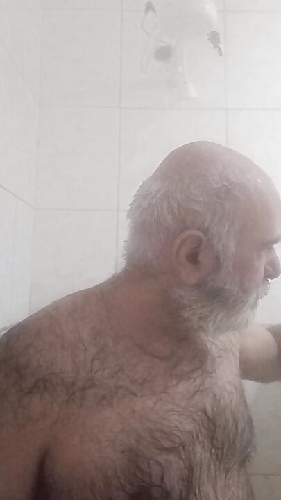 HAIRY BRUTE TAKING A SHOWER