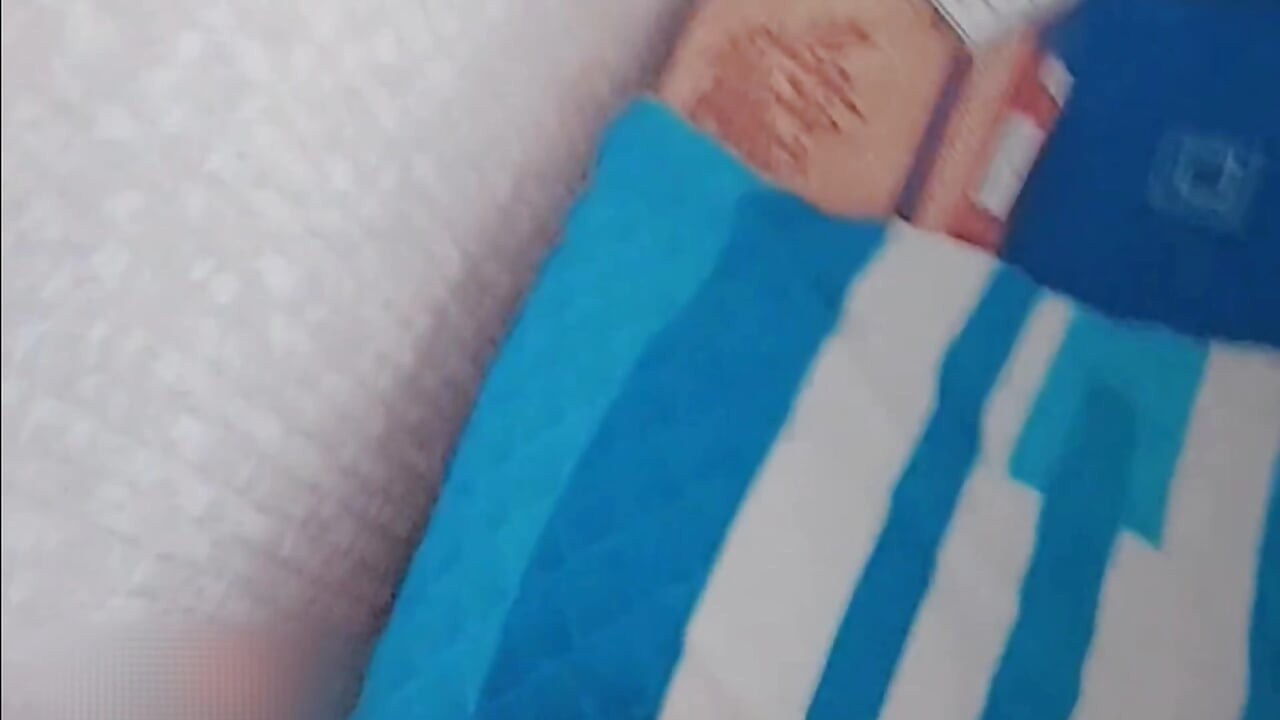 Lovely shemale lying in bed reading cute magazine
