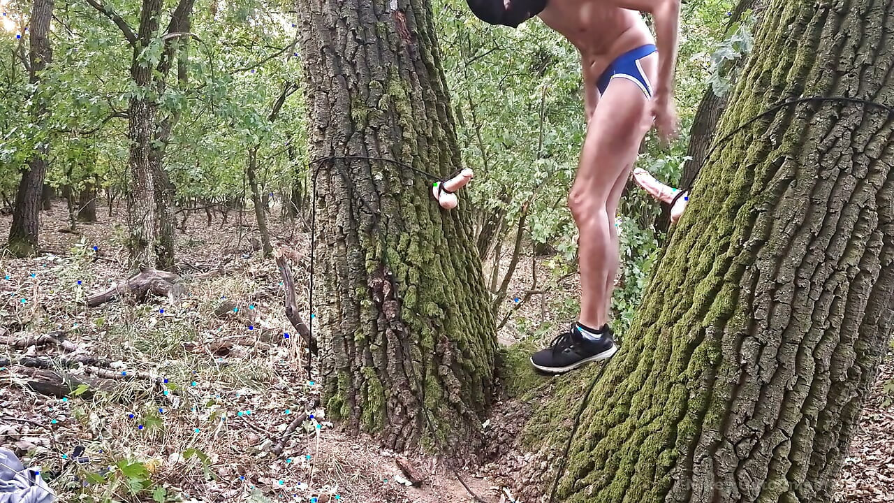 Riding two dildos in the woods