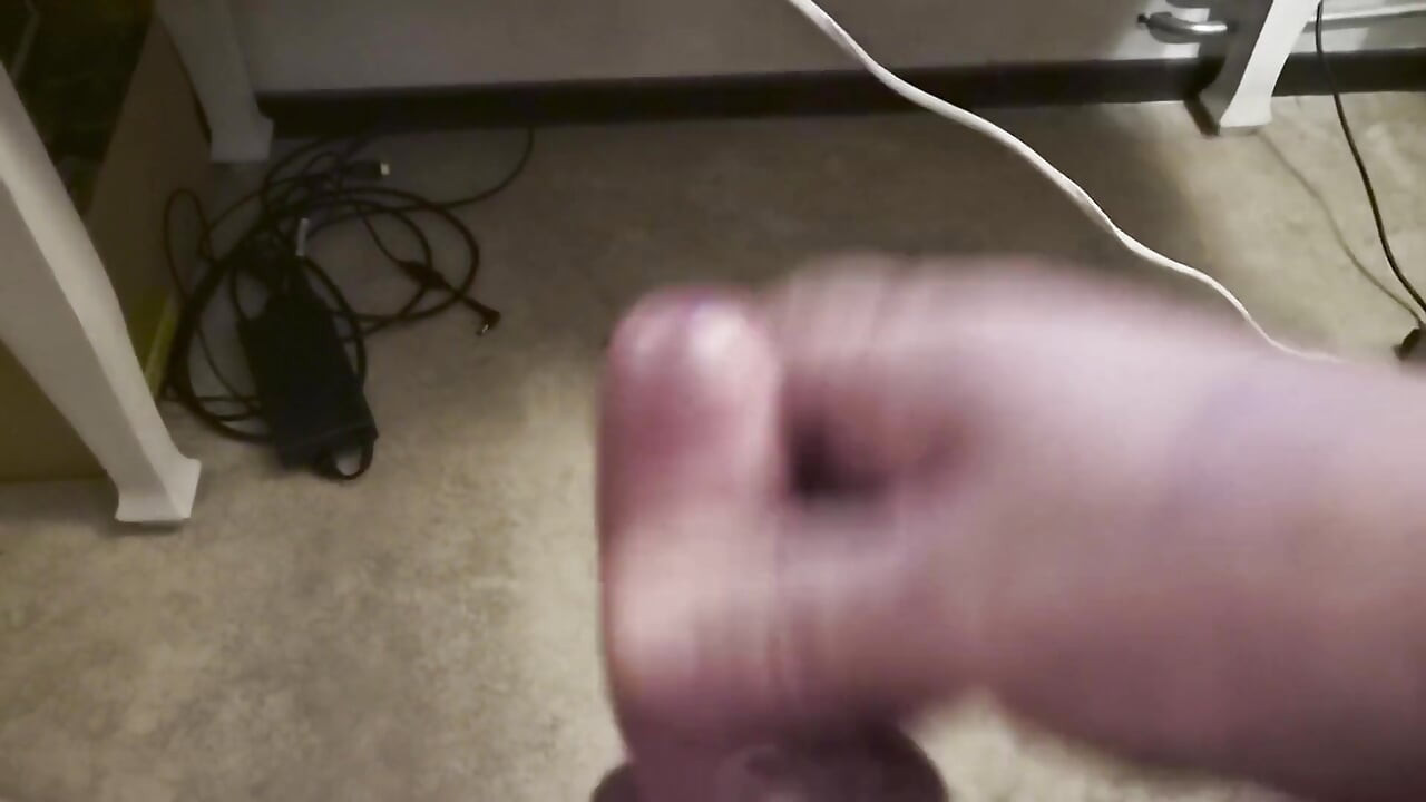 My Friend Sits in a Chair and Jerks off His Cock While Watching Video