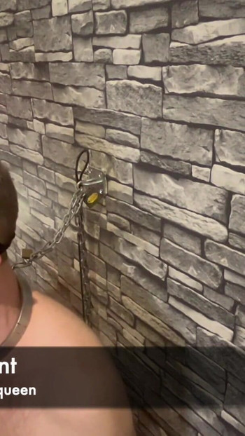 Iconic moment from "Femdom mistress punishes chastity slave leaves him chained to the wall naked"