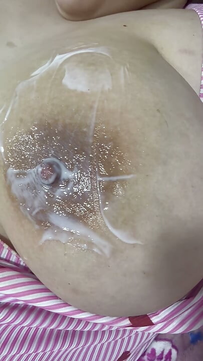 Mom plays with her cream on her delicious huge tits