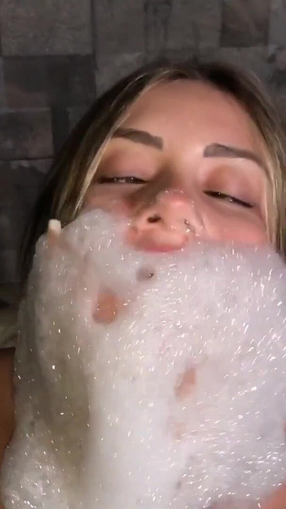 Key moment from "Latina whore dances and masturbates for his clients in his uncle's jacuzzi"