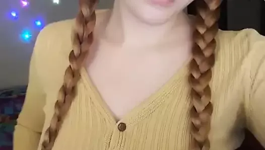 Girl with glasses shows boobs.