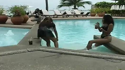 2 sexy Latina's presenting latex fetish in the pool and on the beach