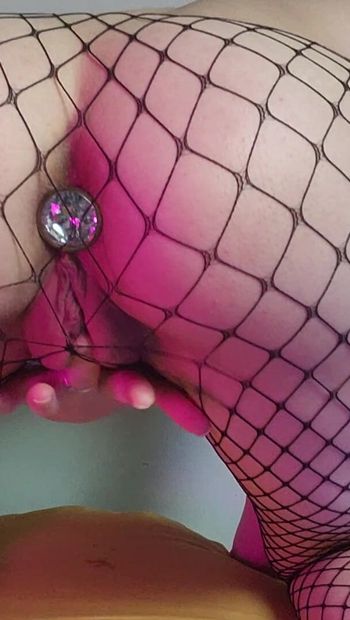 Playing with my buttplug in fishnets