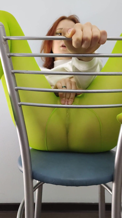 Redhead Teen Feeling Horny in Green Tights on Chair