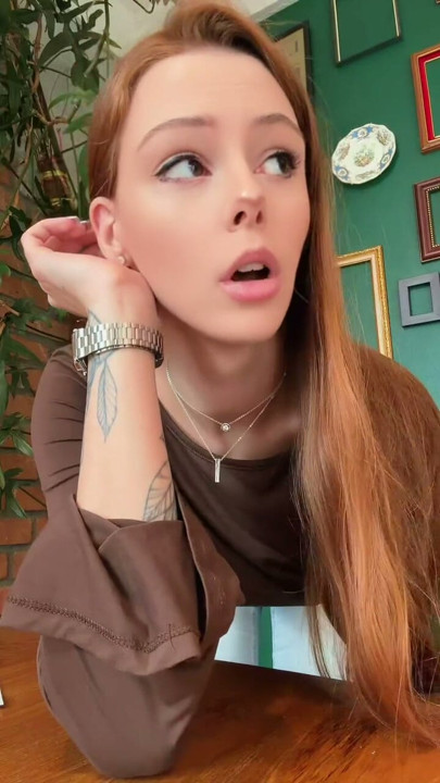 Standing up to give you a full look at this cozy brown top