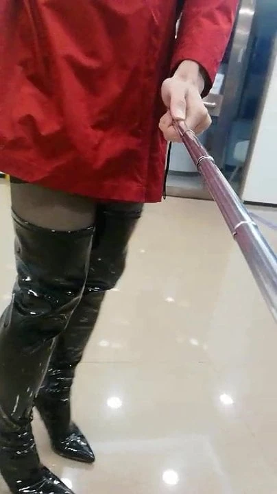 Gurl in boots at a bank
