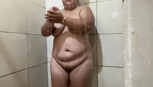 Delight of a large body that this girl who takes a shower and caresses her tits and hair has.