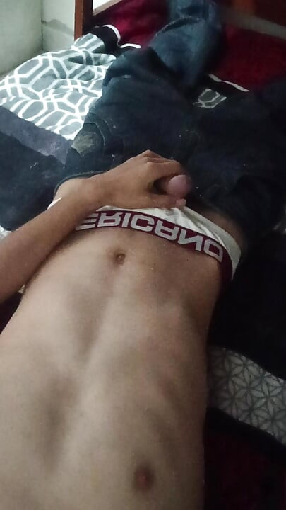 Naked Latino on hot bed wanting to fuck