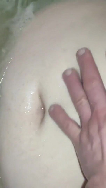 Memorable moment from "Sexy bbw girlfriend gets her nice big belly and big tits massaged in the bathtub. He gets his big"