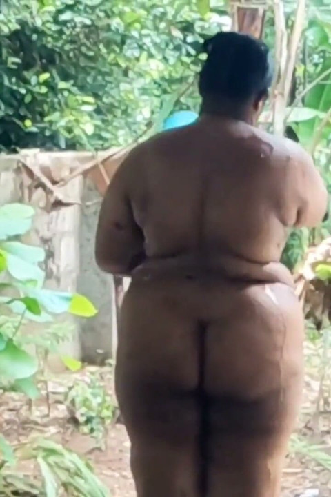 Nudist Planting Trees on Global Nude Gardening Day. Taking Shower Outdoor After Planting Trees.