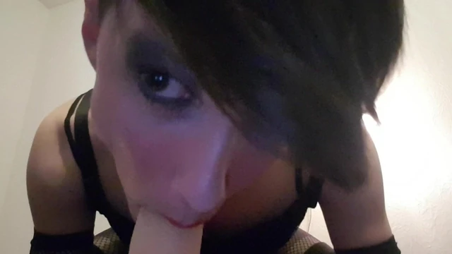 Sissy Mika sucks dildo