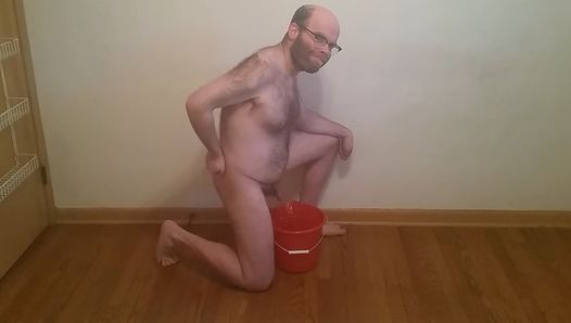 Bear Matt takes piss into red bucket