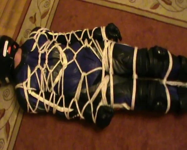 Tied biker in the one-piece leather bikersuit
