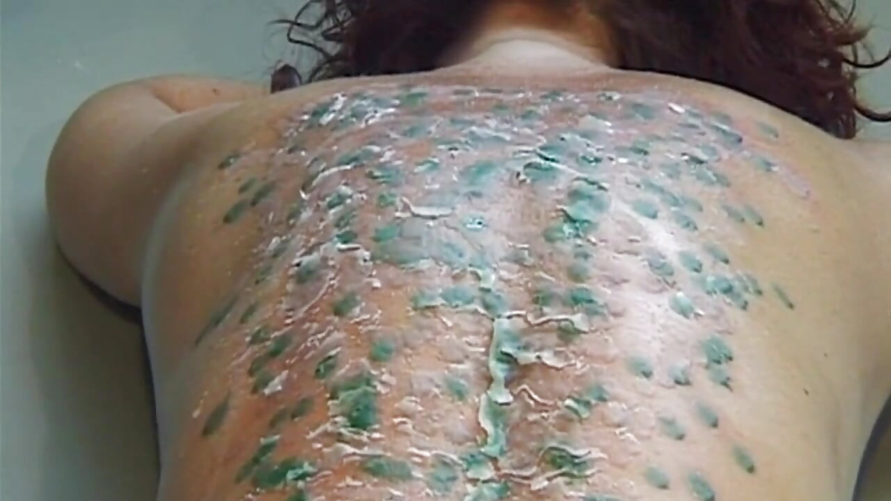 Mature MILF Enjoys Hot Wax Dripping Across Her Ass
