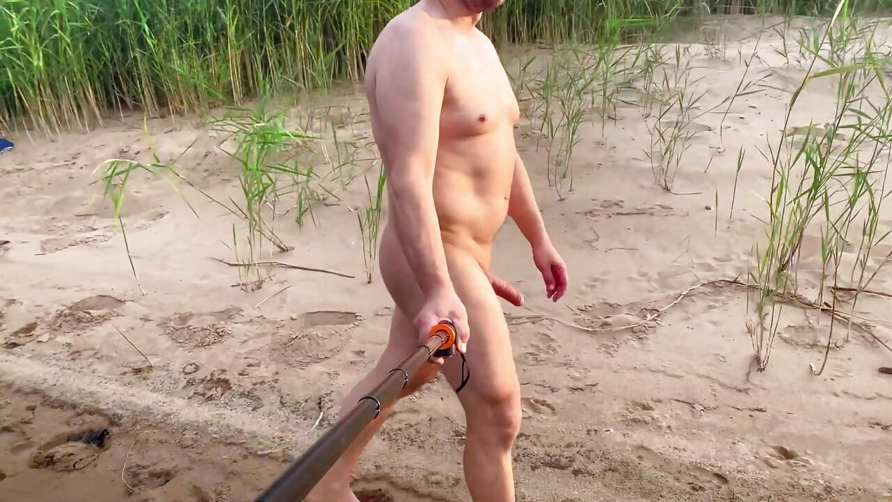 Spcer naked by the river, in public